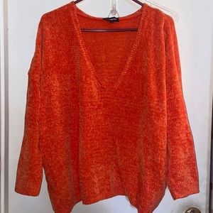 Bright orange sweater